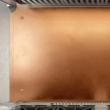 Metal panel with 3 hammered edges and 2 beveled corners